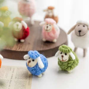 Handmade wool felt sheep figurines in colorful Nordic style for tabletop decorations