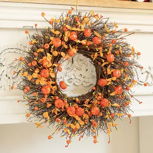 Harvest autumn wreath featuring mini pumpkins and orange berries for front door decor.