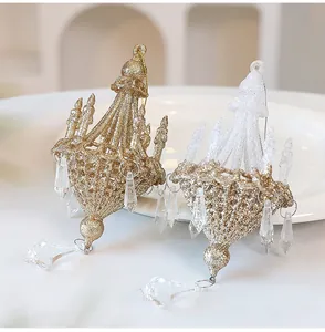 Detailed macro view of gold and white glitter chandelier Christmas tree ornaments with crystals