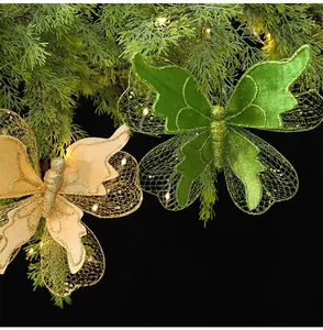Detailed view of green and gold glittery fabric butterfly Christmas tree ornaments