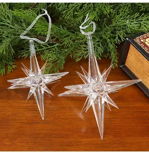 Clear acrylic star icicle ornaments for Christmas tree decoration on wood table