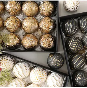 Macro view of 8cm vintage Christmas ornaments with intricate engraved patterns in boxes.