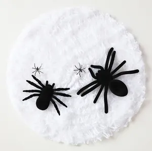 Detail of black fuzzy spiders and plastic spider props for Halloween decorations