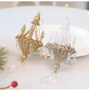 Elegant gold and white Christmas chandelier ornaments featuring crystals and fine glitter