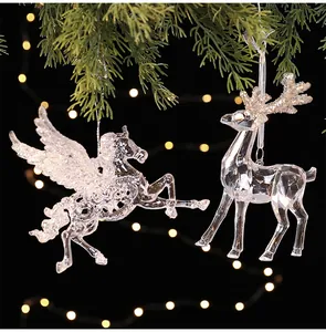Detail of transparent crystal-like acrylic Pegasus and reindeer Christmas ornaments.