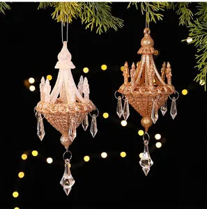 Detail of glitter chandelier Christmas ornaments with crystal pendants on dark background