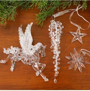 Macro detail of transparent ice crystal acrylic Christmas tree ornaments Pegasus and stars