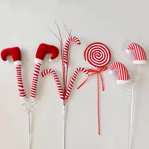 Festive red and white Christmas tree picks set with elf legs, hats and candy canes.