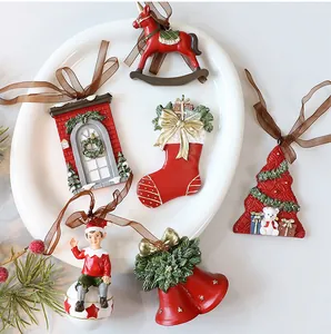 Collection of vintage red and green resin Christmas ornaments displayed on a white plate