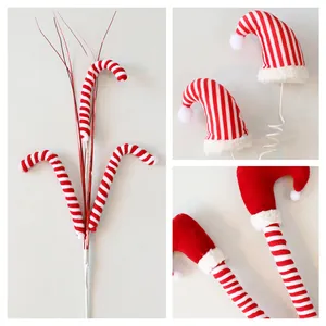 Set of festive red and white striped Christmas tree picks with candy cane elf hat and leg designs