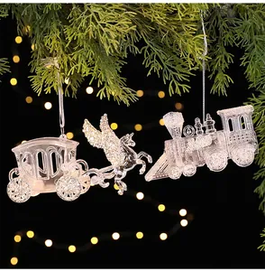Macro detail of transparent acrylic ice crystal ornaments hanging on a pine branch