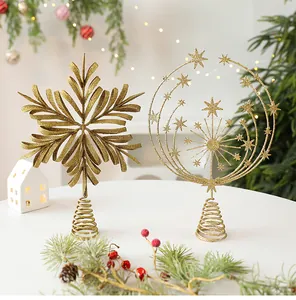 Close-up view of golden glitter iron hollow snowflake and star Christmas tree toppers decorations