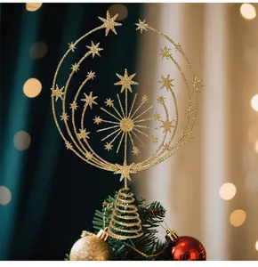 Detailed close-up showing the intricate gold glittery star design of the Christmas tree topper