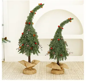 Whimsical green curved Christmas tree ornaments with red berries and burlap bases