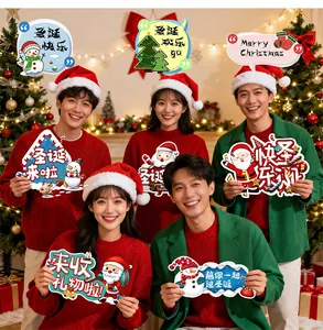 Collection of diverse Christmas handheld placards held by a group in festive setting