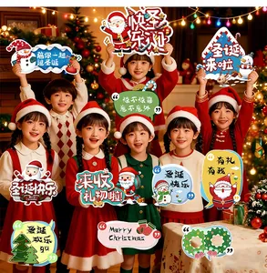 Festive Asian children holding colorful handheld Christmas KT board signs in a holiday setting.