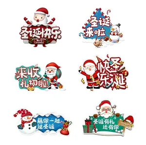 Detail view of six cartoon Christmas decorative boards featuring Santa and snowman designs