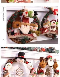 Detailed view of Christmas vine wreaths featuring plush Santa, snowman, and reindeer characters.