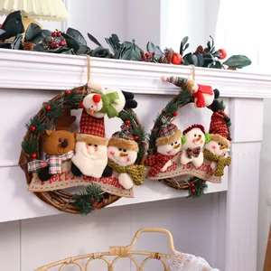 Two decorative Christmas vine wreaths featuring plush Santa Claus, snowman and reindeer