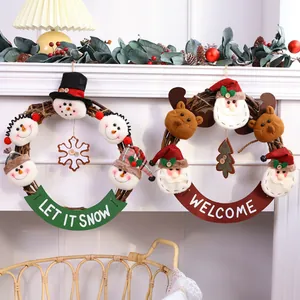 Set of two Christmas vine wreaths with Santa, snowman and reindeer plush decorations