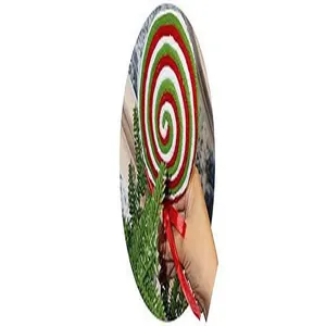 Close-up view of a red, green, and white spiral knitted Christmas lollipop ornament.