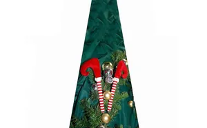 Close-up of festive red and white striped elf legs for Christmas tree decoration