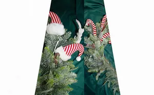 Detail view of striped Christmas elf hats and candy cane picks with sparkly pine branches.