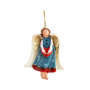 Vintage hand-painted resin angel ornament with red heart and star patterns for tree