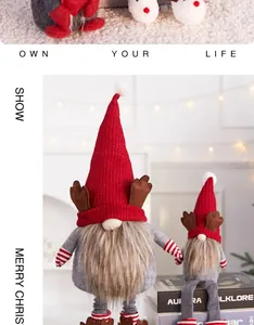 Detailed view of cute Christmas gnomes with red knit hats and reindeer antlers for holiday decor