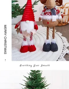 Decorative plush Christmas gnome and reindeer dolls standing in a festive home scene
