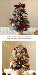 Detailed view of a mini PE Christmas tree featuring warm lights and festive ornaments