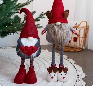 Set of two festive Christmas gnomes with long legs and reindeer shoes decor details.