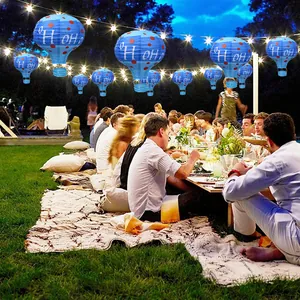 Blue hot air balloon paper lanterns with red dots and OH OH OH Christmas print
