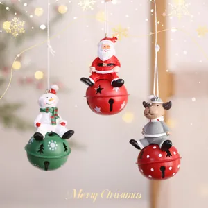 Festive metal Christmas ornaments featuring Santa, a snowman, and a reindeer.