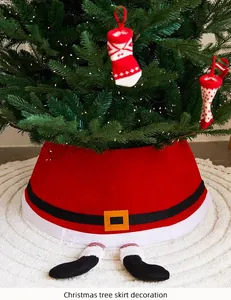 Detail of a red Santa Claus themed Christmas tree skirt featuring decorative elf legs