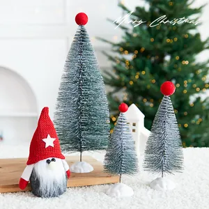 Decorative set with mini Christmas trees and a red hat gnome figurine for holiday table decor
