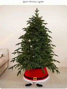 Festive Santa style red Christmas tree skirt shown in a cozy indoor holiday setting