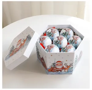 Coffret cadeau de Noël avec des boules en mousse peintes, motifs Père Noël et renne