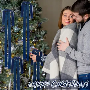 Large dark blue velvet bows decorating a Christmas tree in a festive holiday home setting