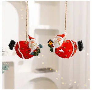 Set of two resin Santa Claus ornaments hanging with twine for Christmas decor