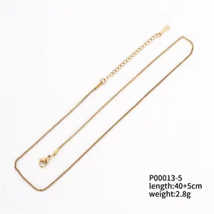 Detail view of 18k gold plated box chain necklace with lobster clasp and extension chain