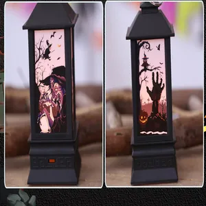 Detail view of two Halloween LED lanterns featuring spooky witch and zombie hand motifs.