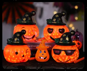 Detailed view of assorted glowing Halloween pumpkin lanterns with witch hats.
