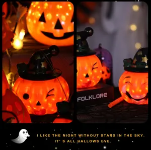 Close-up of glowing Halloween pumpkin lanterns with witch hats for festive party decor