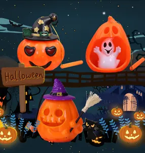 Assorted glowing Halloween pumpkin lanterns featuring witch hats and ghost figurine designs