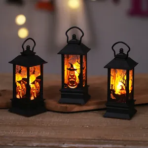 Set of three black Halloween LED lanterns with spooky witch and pumpkin silhouettes