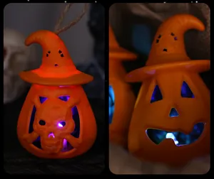 Detail of glowing Halloween pumpkin lanterns with witch hats and skull designs