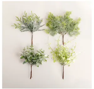 Selection of four different artificial green plant sprigs for DIY forest-style home decor