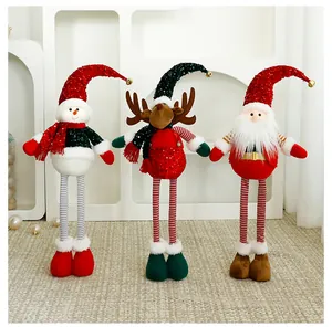 Festive Christmas standing plush dolls featuring snowman reindeer and Santa Claus with sequined hats.