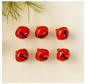 Detailed view of six glossy red jingle bells ornaments for festive Christmas tree decor